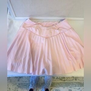 Criss Cross Waist Band, pleated pink tennis skirt with built in shorts!